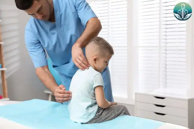 Child with kyphosis receiving physiotherapy treatment to correct posture in Kuwait